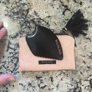 Wildling empress guasha stone with cushioned pouch.